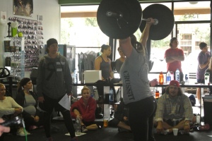14.1 in action with Melissa and Aaron cheering and coaching her on.