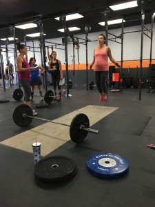Coach Luz coaching me through one of the CrossFit Open WODs at Full Strength.